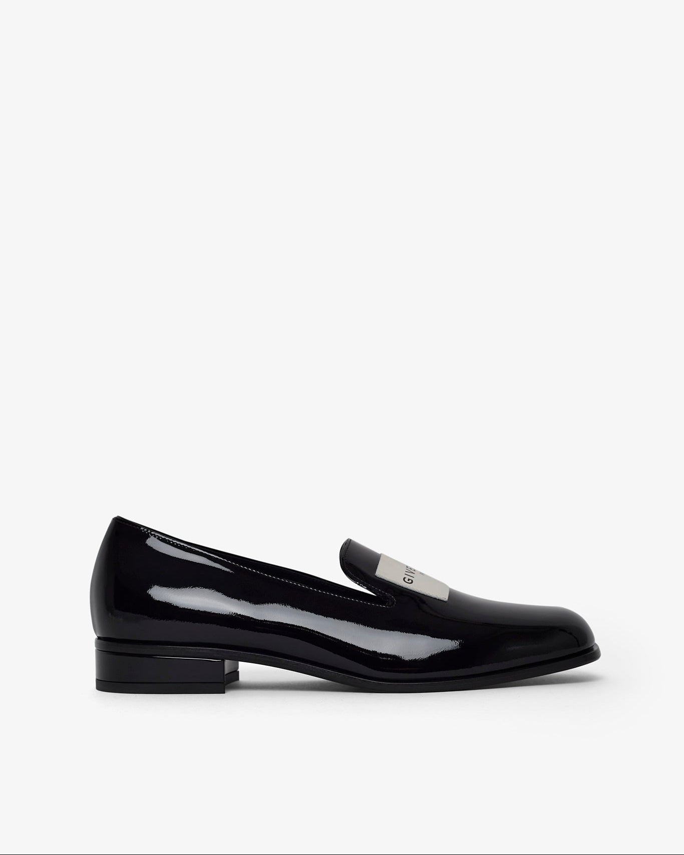 Brown studded flat shoe on a white background